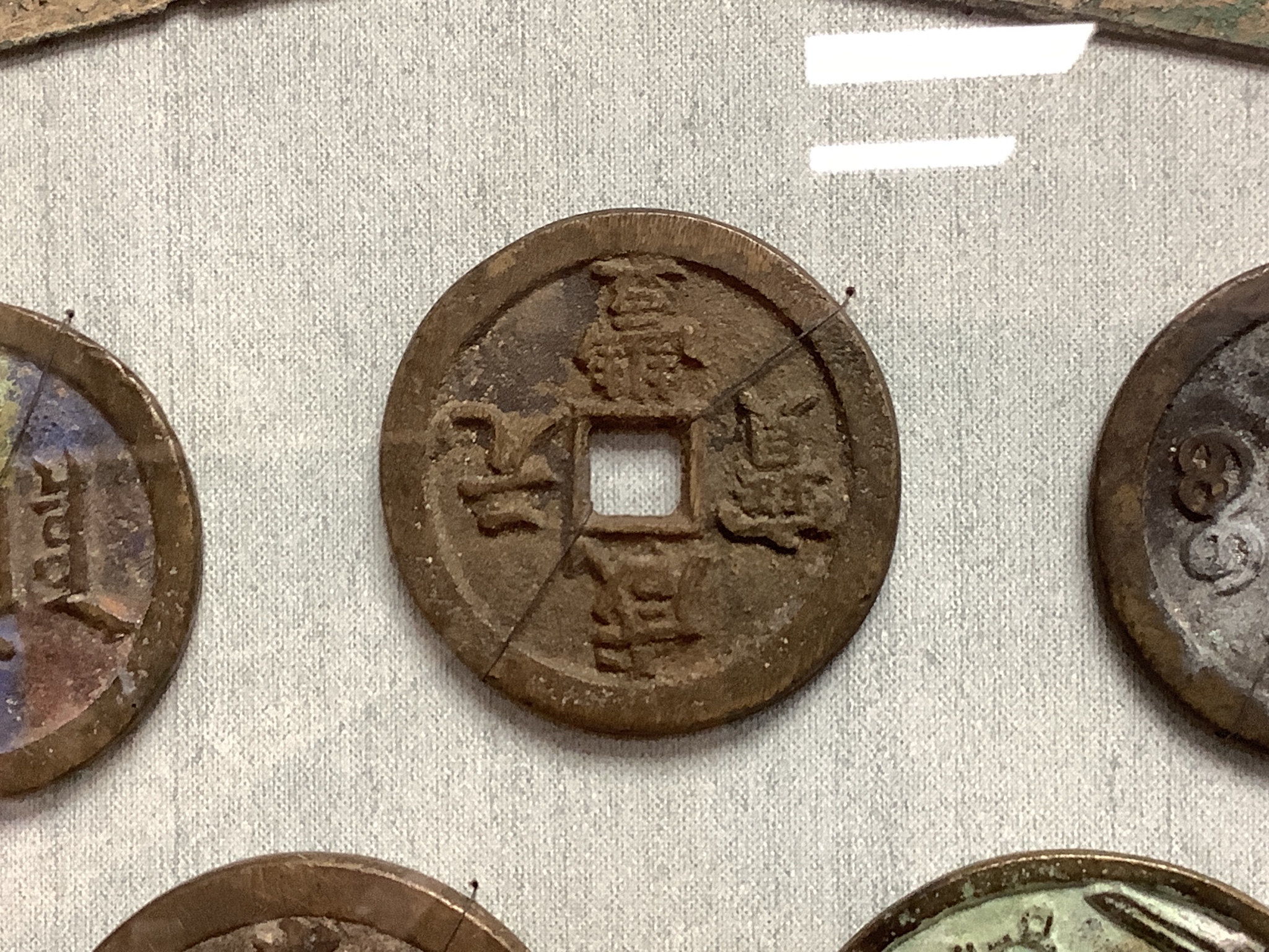 A quantity of framed Chinese coins